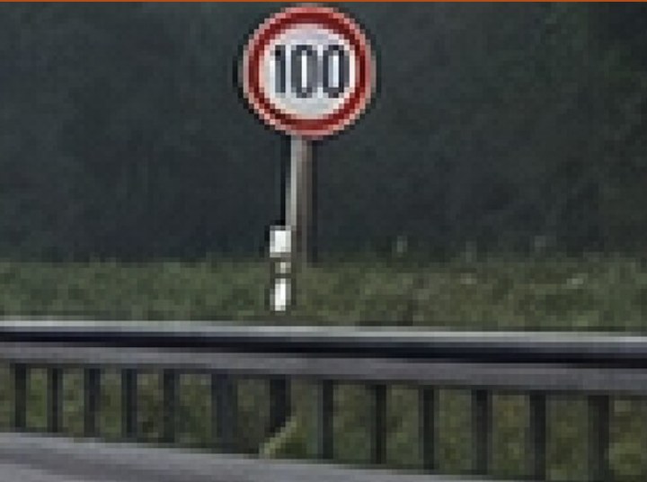 The restored image: the sign now reads 100.